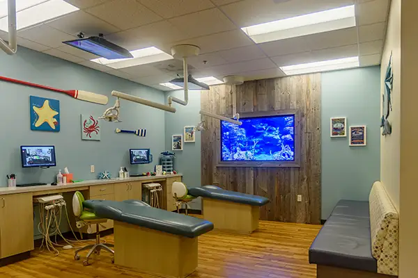 A colorful, calming aquarium themed room at Jacobsen Pediatric Dentistry 