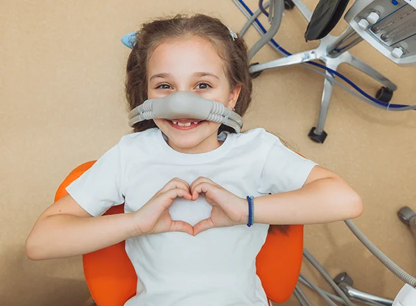 Child receiving sedation at the dentist office